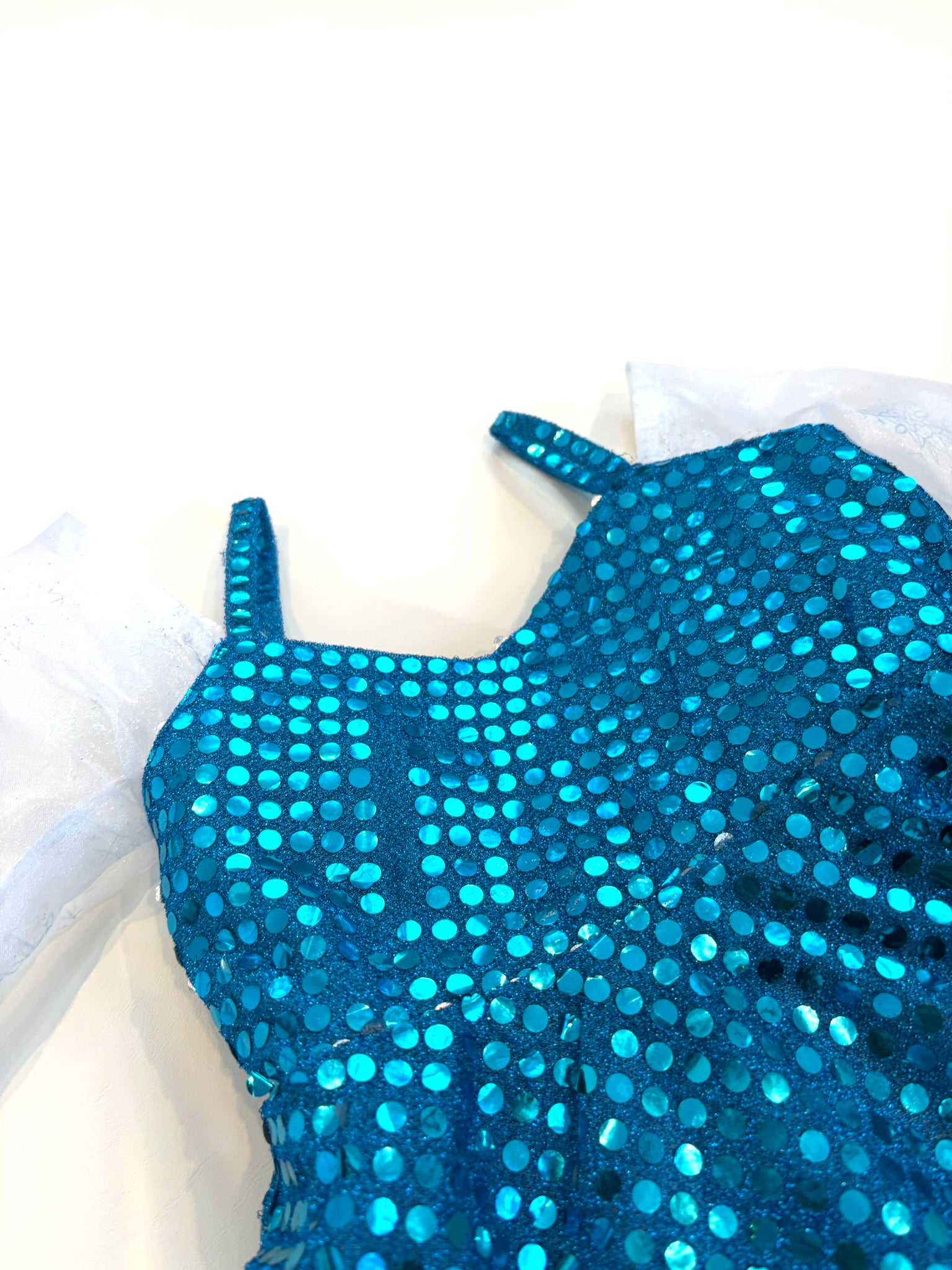 Blue sequin dress on a white background