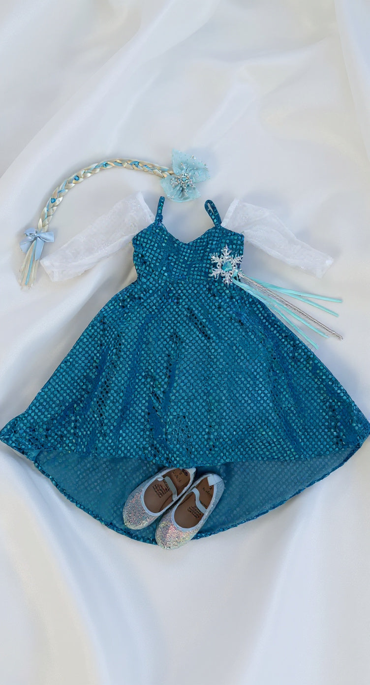 Blue dress with matching shoes and headband on a white background