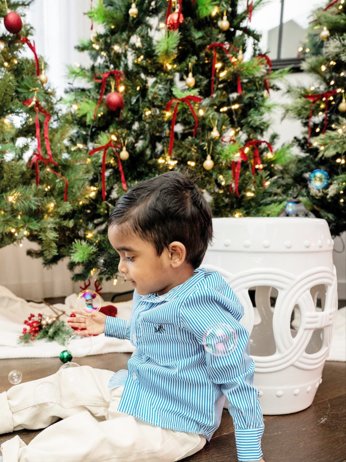 boy wearing a white and blue stripe shirt