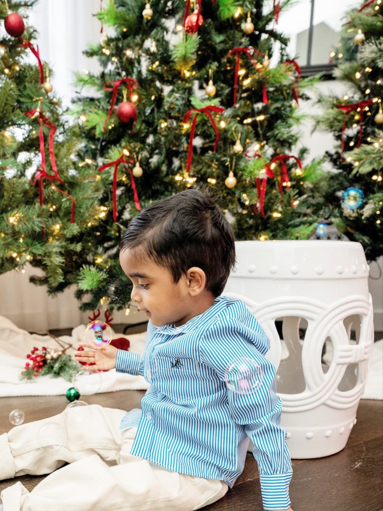 boy wearing a white and blue stripe shirt